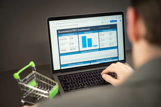 A photo of an employee checking PPC performance on an ecommerce dashboard on a laptop. This image has been made available for use under the Creative Commons Licensing agreement. If you use it, please link back to our website at www.zuko.io. A protocol for comparing marketplace attribution methods on one seller group and one window